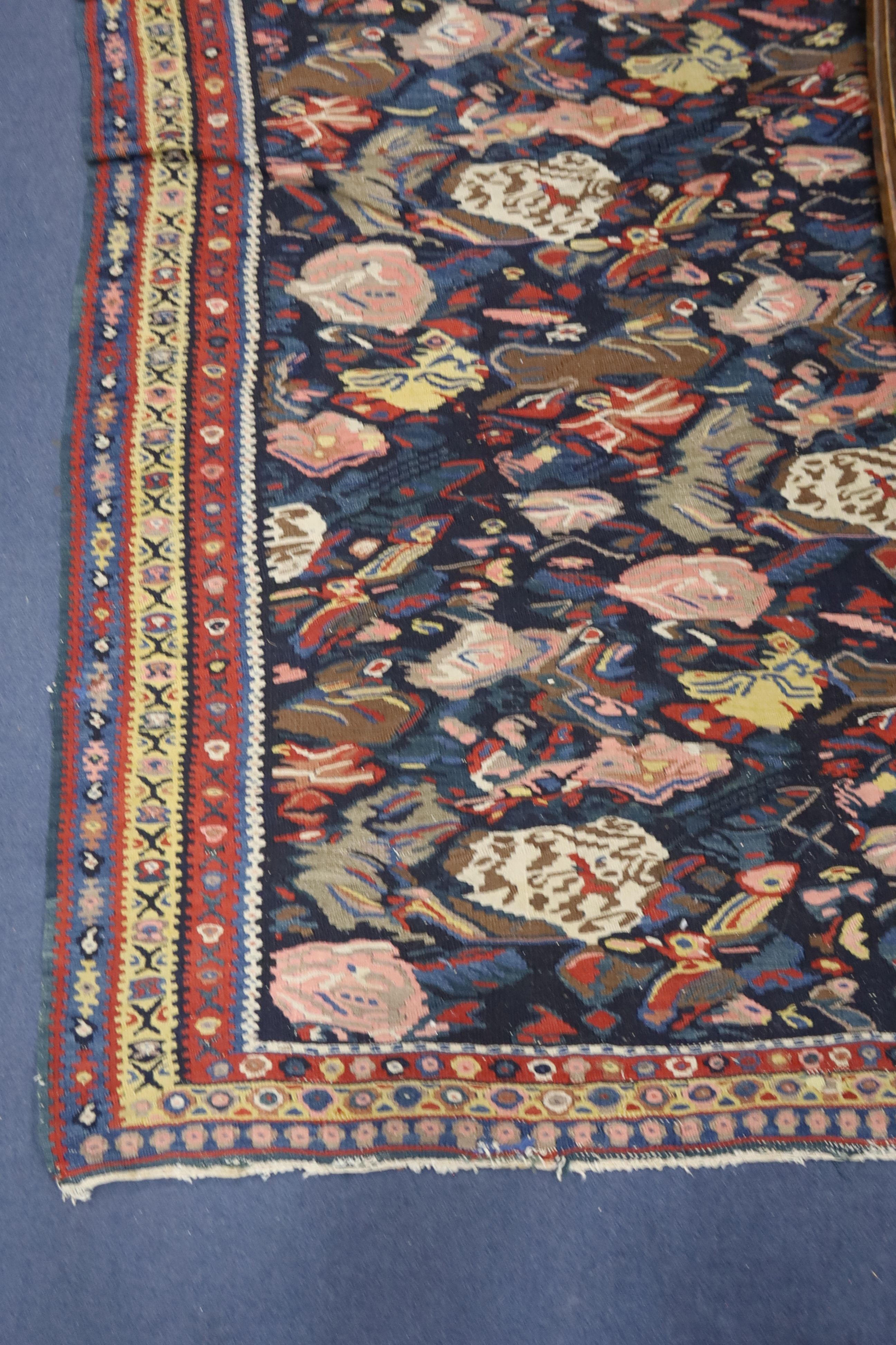 A late 19th century / early 20th century Senneh polychrome Kilim rug, 190 x 130cm